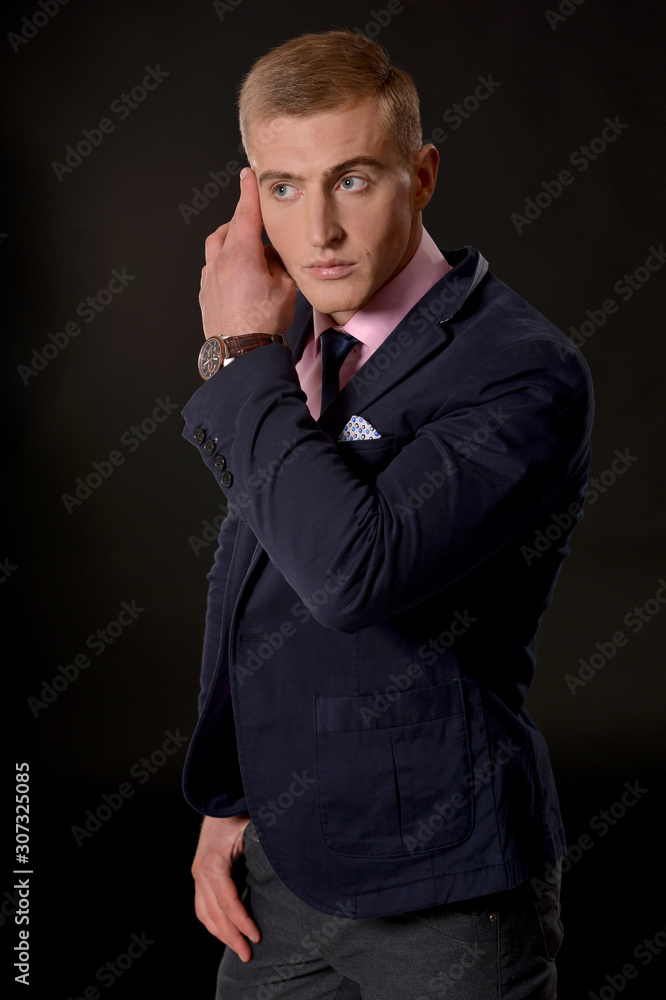 Portrait of a young businessman posing in studio Portrait of a young businessman posing in studio