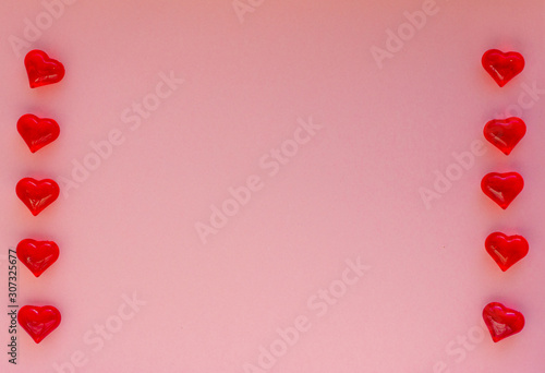 Hearts on a pink background. Valentin s Day  top view. Copy space. Flat lay. Greeting card.