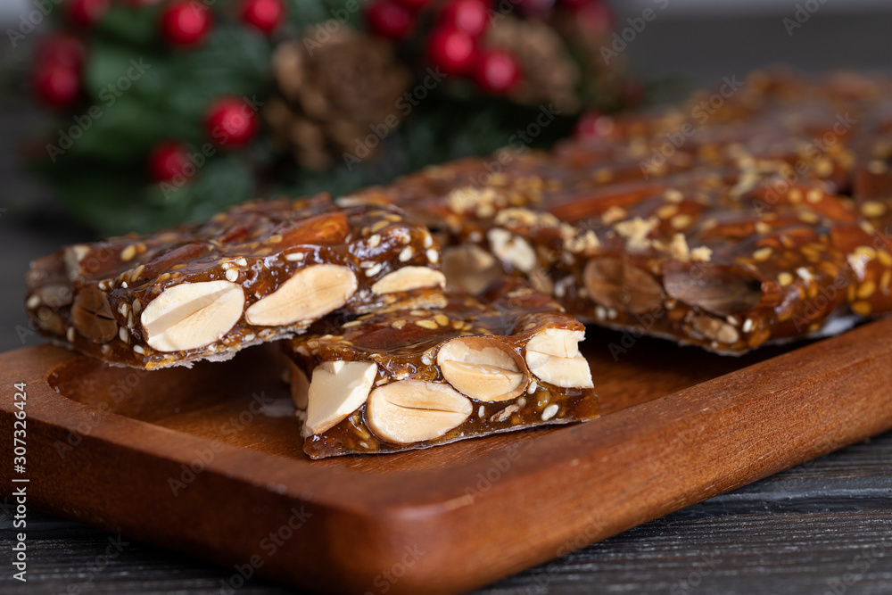 Turron guirlache, Hard nougat made with almond and caramel. Traditional Christmas sweet consumed in Spain. Turron guirlache, Hard nougat made with almond and caramel. Traditional Christmas sweet consumed in Spain.
