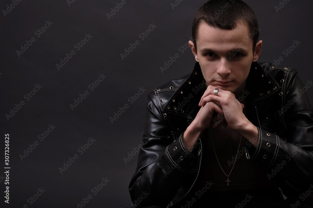 Obraz premium Young pensive man