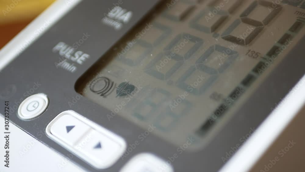 Close up and selective focus of a blood pressure and heart rate ( pulse ) monitor Close up and selective focus of a blood pressure and heart rate ( pulse ) monitor