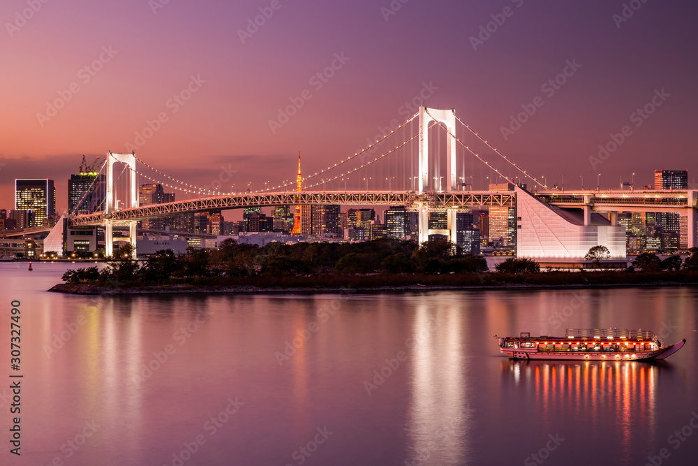 Rainbow Bridge and Sumida River in Tokyo, Japan. Night photo.