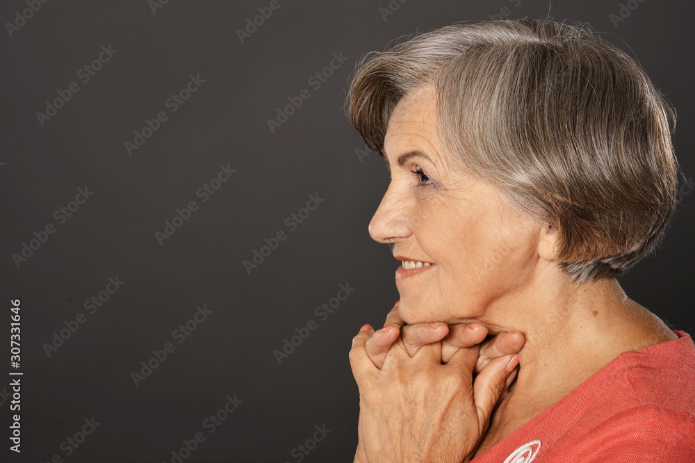 Close up portrait of happy smiling senior woman posing