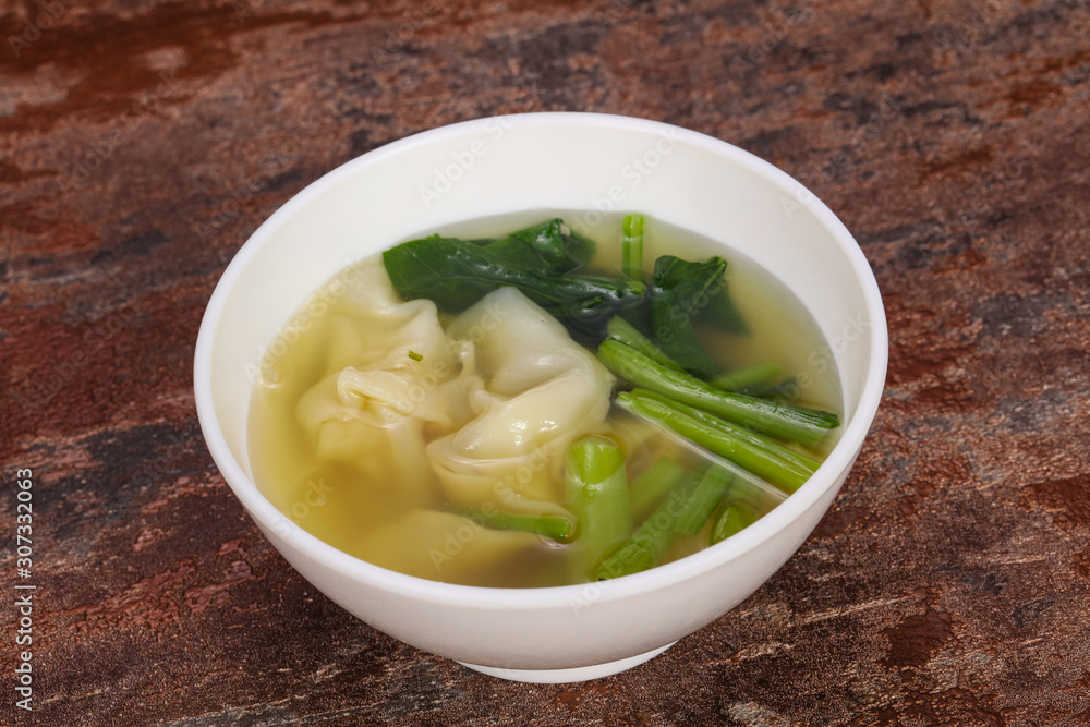 Asian traditional Wonton soup with herbs