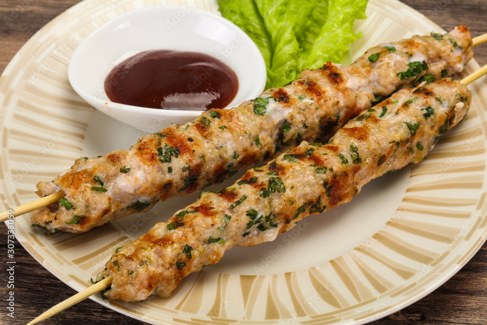 Minced pork skewer kebab with sauce Minced pork skewer kebab with sauce