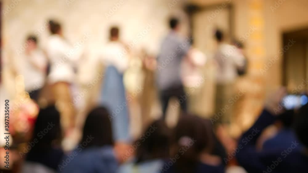 Defocus background of Thai female dancers and tourists doing traditional Thai dance ( Ram Wong ) together Defocus background of Thai female dancers and tourists doing traditional Thai dance ( Ram Wong ) together