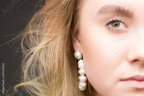 close up portrait of blonde girl in Studio dark background