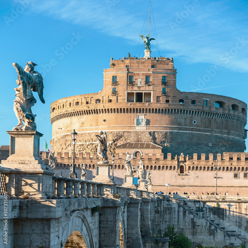 Photography Rome, Italy - October 9, 2019 - view of the sculptures of angels and the castle of the Holy Angel on a background of blue sky