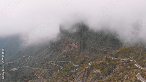 Clouds and mountains. Rainy weather in the canyon in the mountains, view from above.