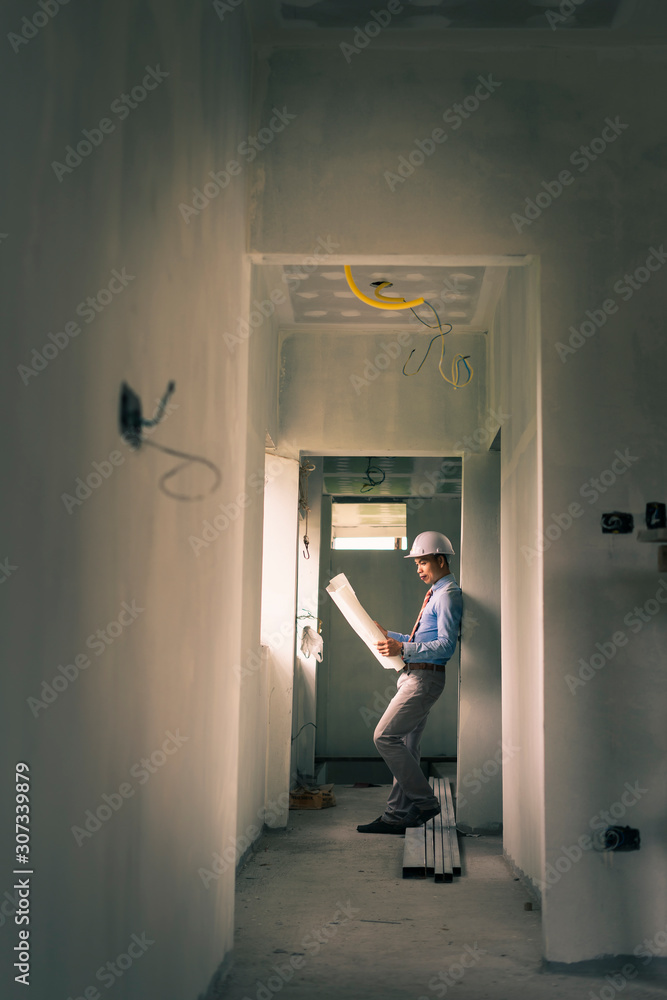 Fototapeta premium Asian engineer is working on construction site.