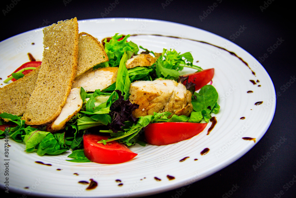 Caesar salad on black background Caesar salad on black background
