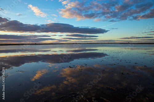 Sunset mirror reflections in Lake Tyrrell, a popular tourist destination in North West Victoria.