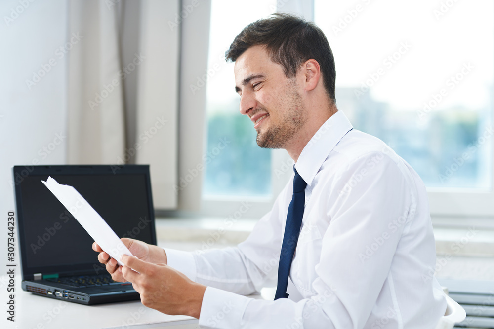 businessman working on his laptop in office businessman working on his laptop in office