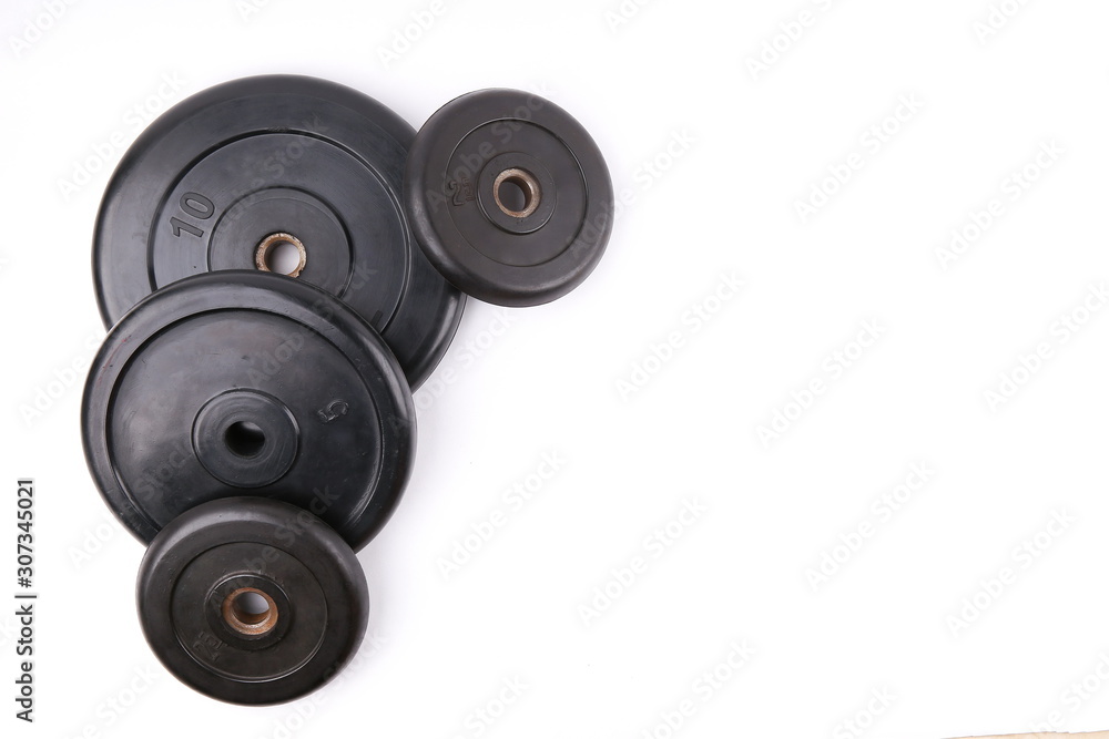 barbell weights on white background with copy space barbell weights on white background with copy space