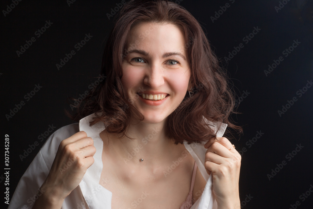 brunette with flying hair laughing, sitting in pink bra, unbuttoned white  shirt and white pants Stock Photo | Adobe Stock