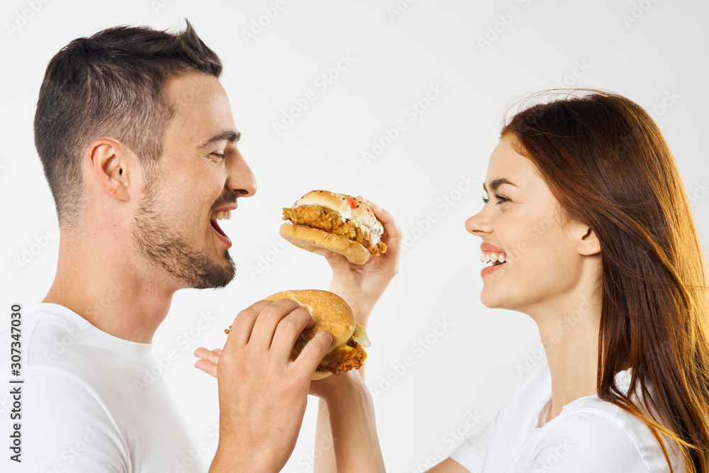 man and woman eating cake isolated on white man and woman eating cake isolated on white
