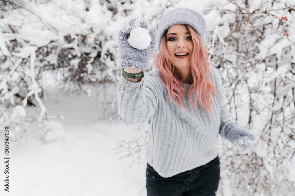 Young Blonde Woman in Gray Sweater is Enjoying Winter Young Blonde Woman in Gray Sweater is Enjoying Winter