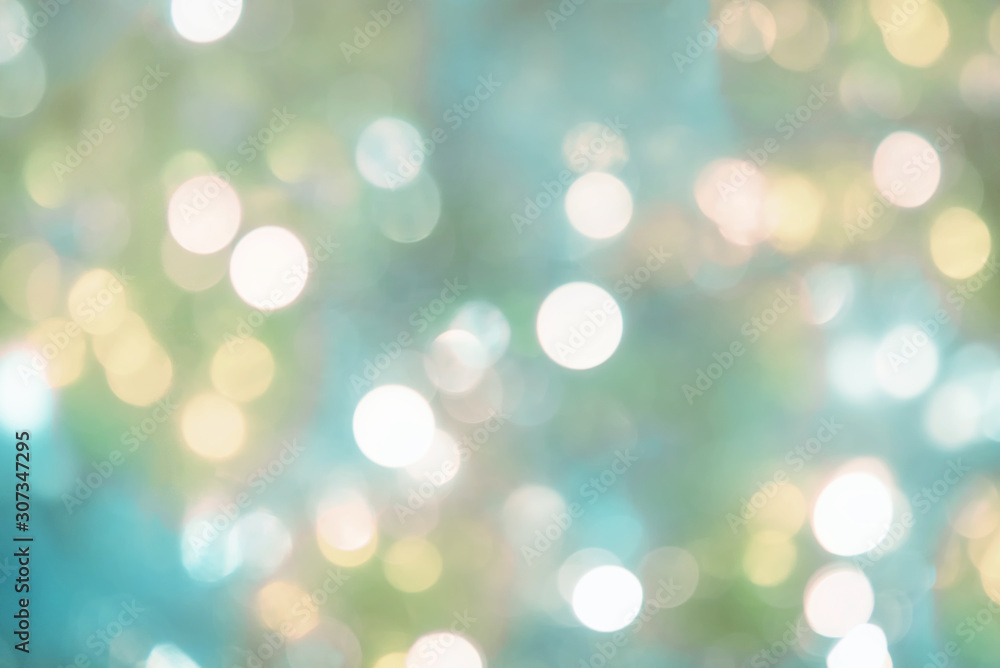 blurry background of christmas lights - light pastel turquoise and green