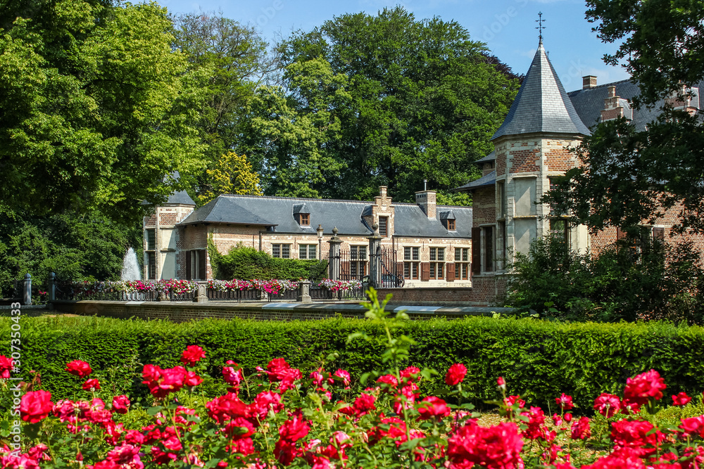 Castle Veltwijck near Antwerp, Belgium. The castle complex in the park is made in traditional brick and sandstone style.