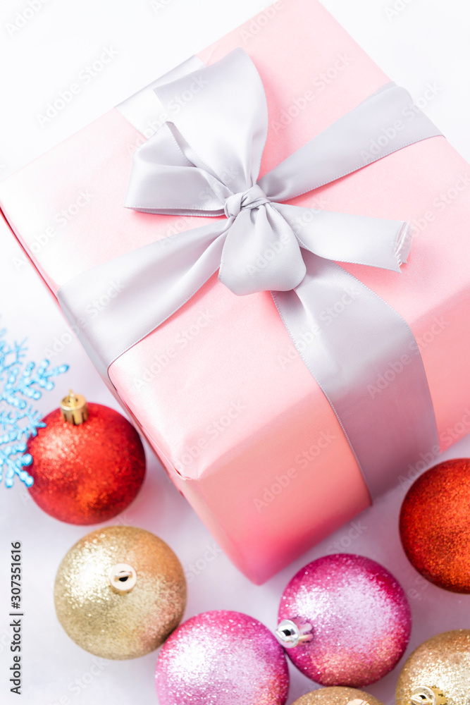Christmas gifts and balls on snow background Christmas gifts and balls on snow background