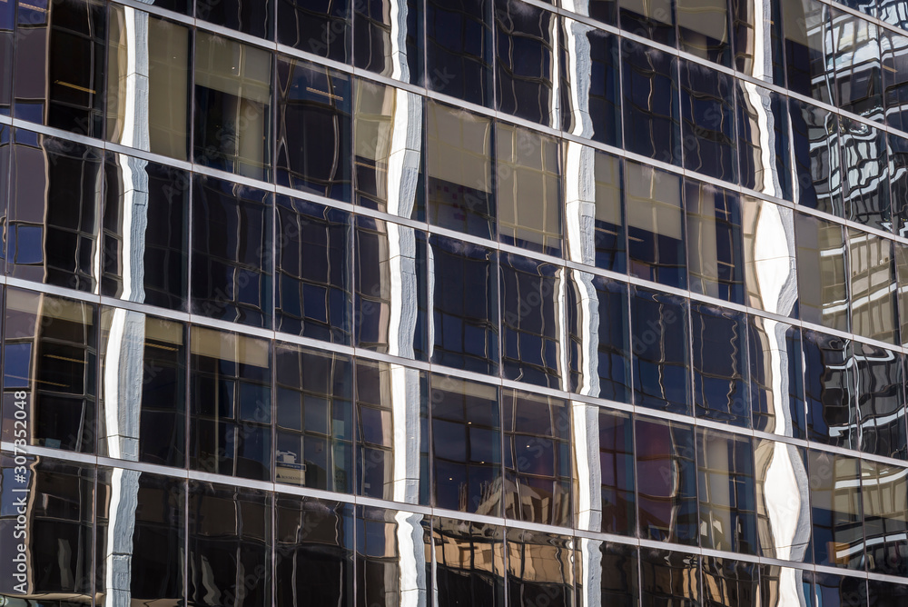 Obraz premium Reflections in glass building on Macquarie Street in the western suburb of Parramatta, Sydney, Australia