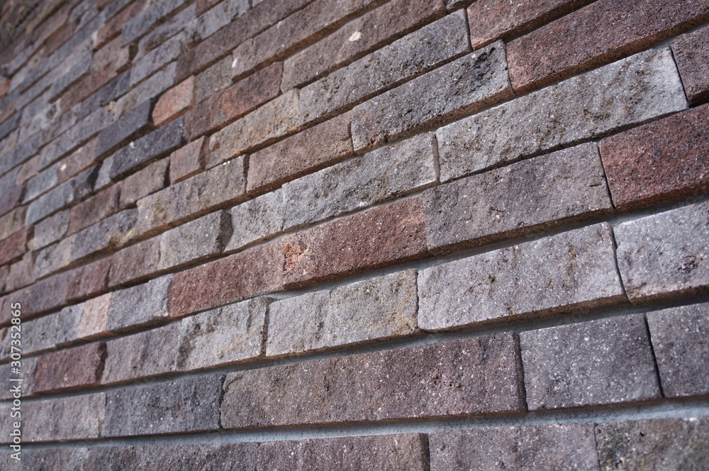 The uneven tiled outer wall of the store The uneven tiled outer wall of the store