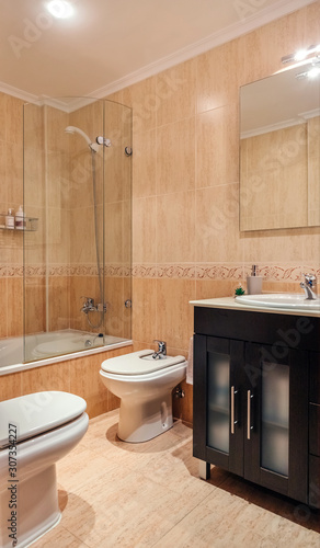 Interior of bathroom with mirror and shower screen