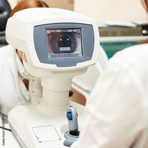 ophthalmologist doctor in exam optician laboratory with female patient. Eye care medical diagnostic. Eyelid treatment