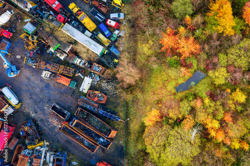 Industry and Nature, a Scrapyard next to a beautiful rural landscape and woodland in Wales, United Kingdom