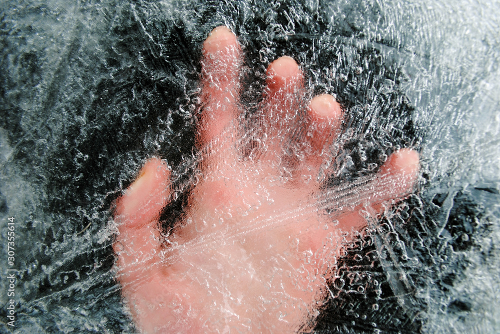 Hand under a layer of ice. Man under the ice. Save the drowning under the ice. Hand under a layer of ice. Man under the ice. Save the drowning under the ice.