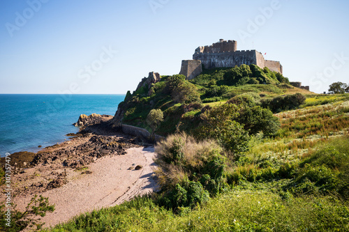 Mont Orgueil Castle and a small bay  which used to provide boat protection and landings for loading and unloading