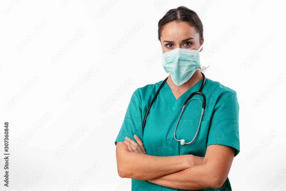 Beautiful female doctor in green uniform. Portrait of nurse with mask Beautiful female doctor in green uniform. Portrait of nurse with mask
