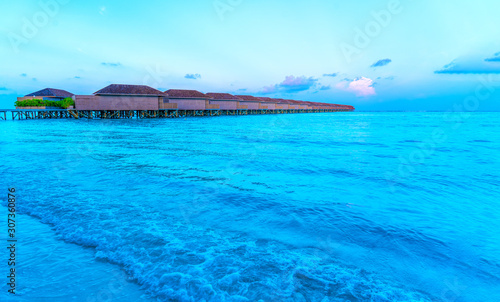 Wooden bridges leading to the huts on the shores of the tropical