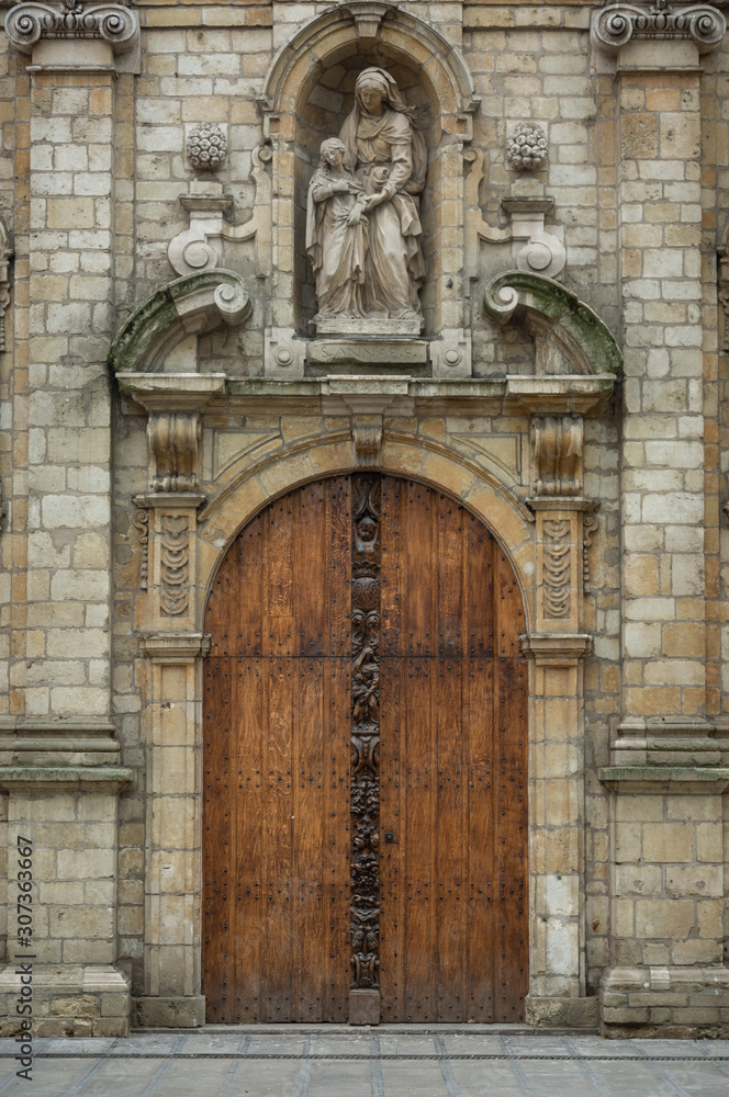 Door of medieval catholic church in Belgium