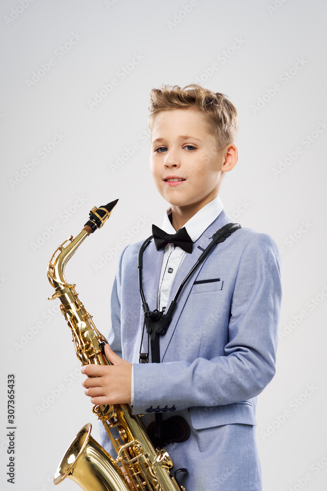 Fototapeta premium boy with saxophone