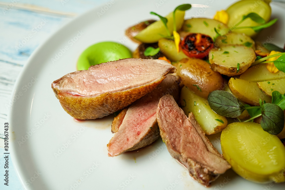 Pork dish on a restaurant table Pork dish on a restaurant table