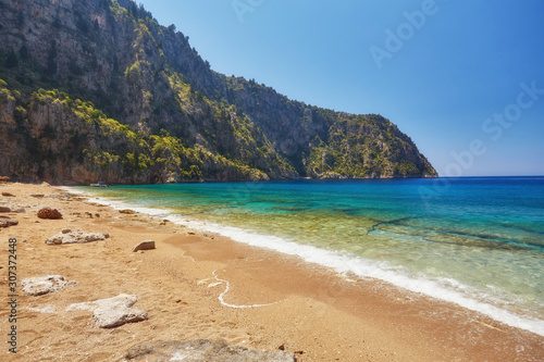 Summer butterfly valley sea beach view and cruise boat Oludeniz