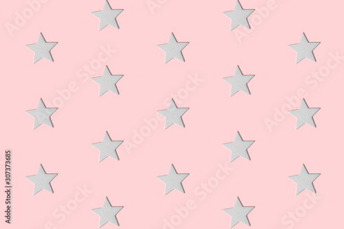 Seamless pattern of five-pointed stars abstract on rose. Holiday background.