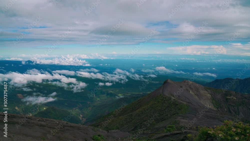 Time-lapse Cinemagraph / seamless video loop of the impressive Irazu Volcano Crater at Cartago, Costa Rica. Clouds are moving across the land the view is upon the Caribbean Sea. Time-lapse Cinemagraph / seamless video loop of the impressive Irazu Volcano Crater at Cartago, Costa Rica. Clouds are moving across the land the view is upon the Caribbean Sea.