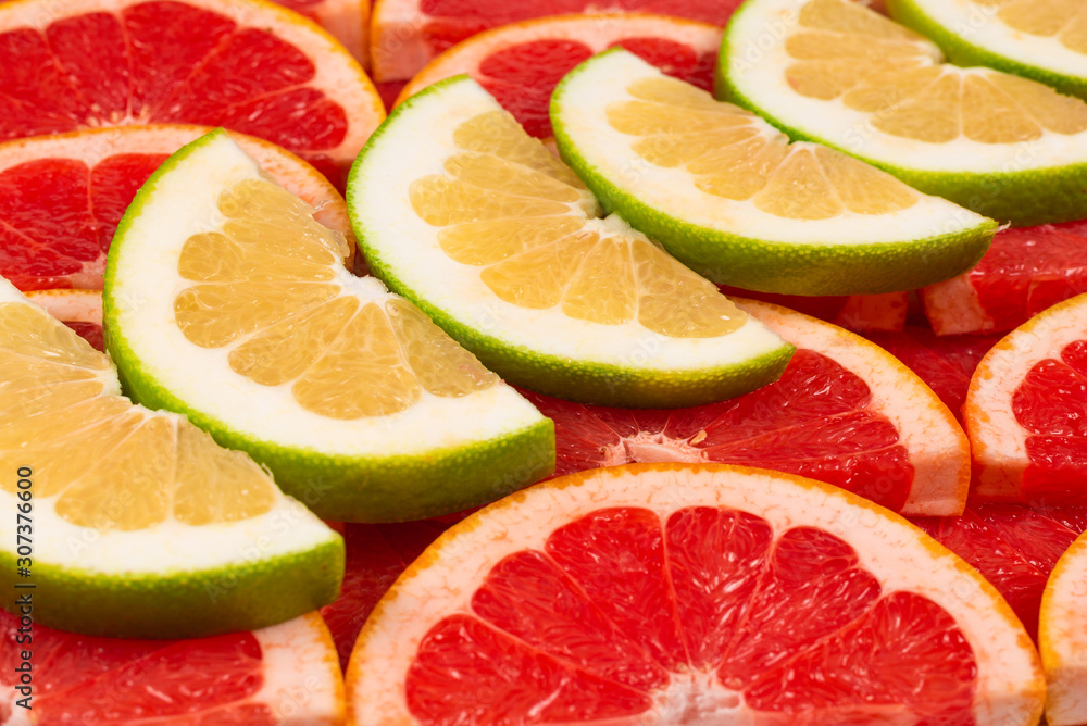 Pomelo and grapefruit slices background. Pomelo and grapefruit slices background.