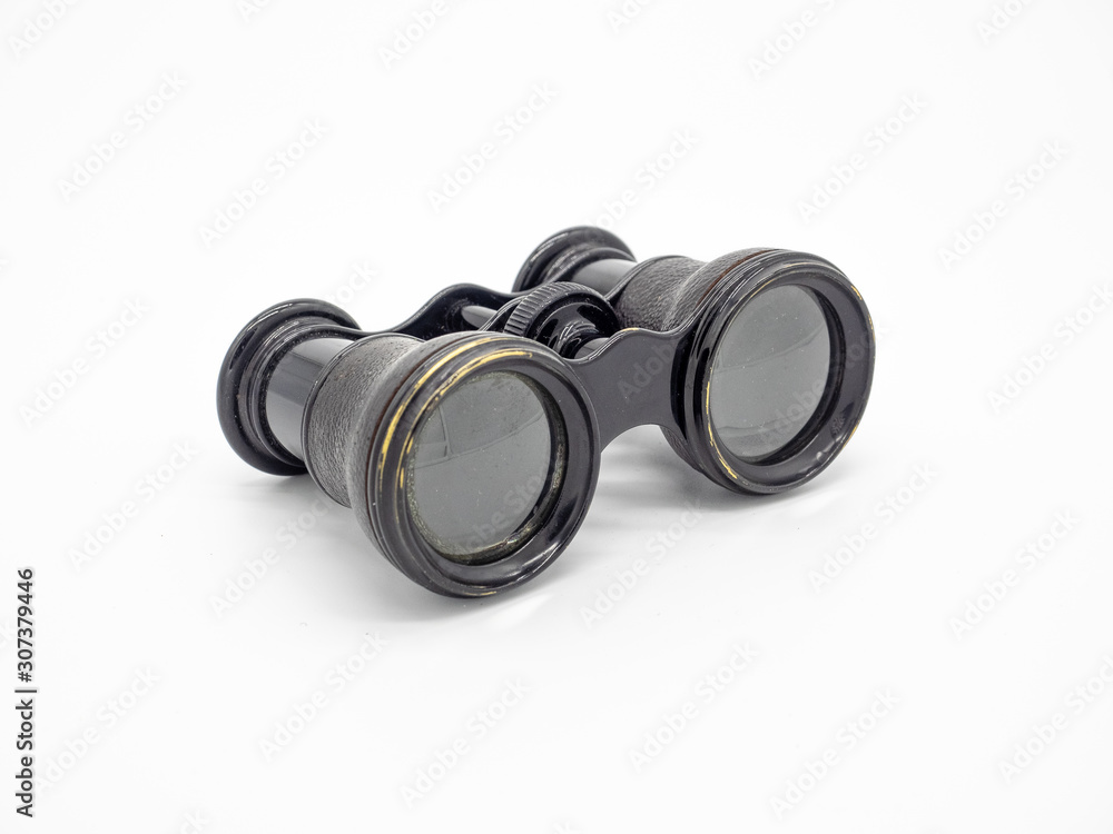 Antique opera glasses isolated on white background. Black small vintage binoculars. Antique opera glasses isolated on white background. Black small vintage binoculars.