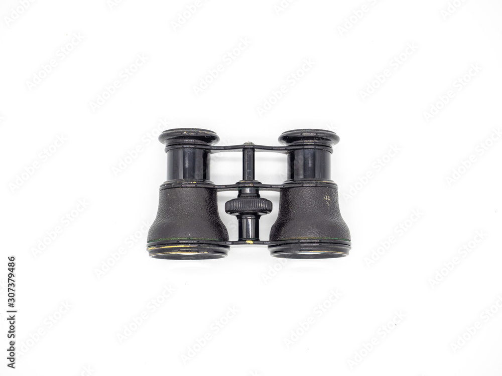 Antique opera glasses isolated on white background. Black small vintage binoculars. Antique opera glasses isolated on white background. Black small vintage binoculars.