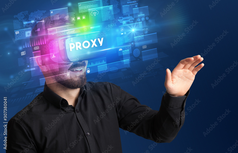 Businessman looking through Virtual Reality glasses with PROXY inscription, innovative security concept Businessman looking through Virtual Reality glasses with PROXY inscription, innovative security concept