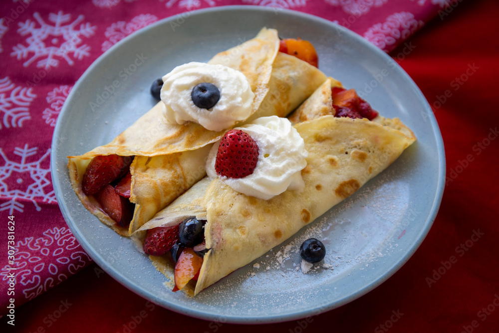 Crepes with Fresh Berries, Chocolate Sauce and Powdered sugar Crepes with Fresh Berries, Chocolate Sauce and Powdered sugar