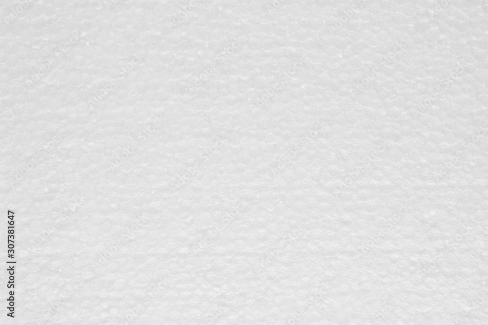 Fototapeta uniform texture of white foam close up.