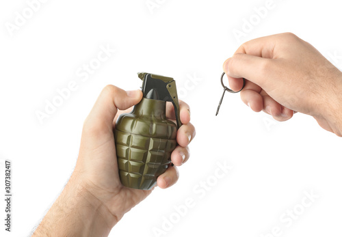 Hand pulls a check from a grenade
