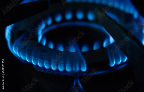 A Macro Image of a Blurry Blue Flames on Gas Stove Burner.