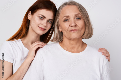 portrait of mother and daughter isolated on white