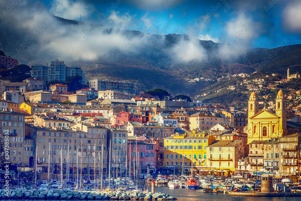 Bastia, a beautiful city on the island of Corsica, France, a view of the historic center of the city, a port with boats and yachts. A popular destination for traveling in Europe