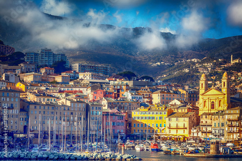 Bastia, a beautiful city on the island of Corsica, France, a view of the historic center of the city, a port with boats and yachts. A popular destination for traveling in Europe